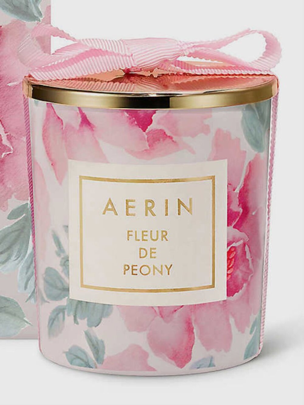 New AERIN candle, Fleur de Peony. 7 ozs. White wax w/ pink floral and gold lid.